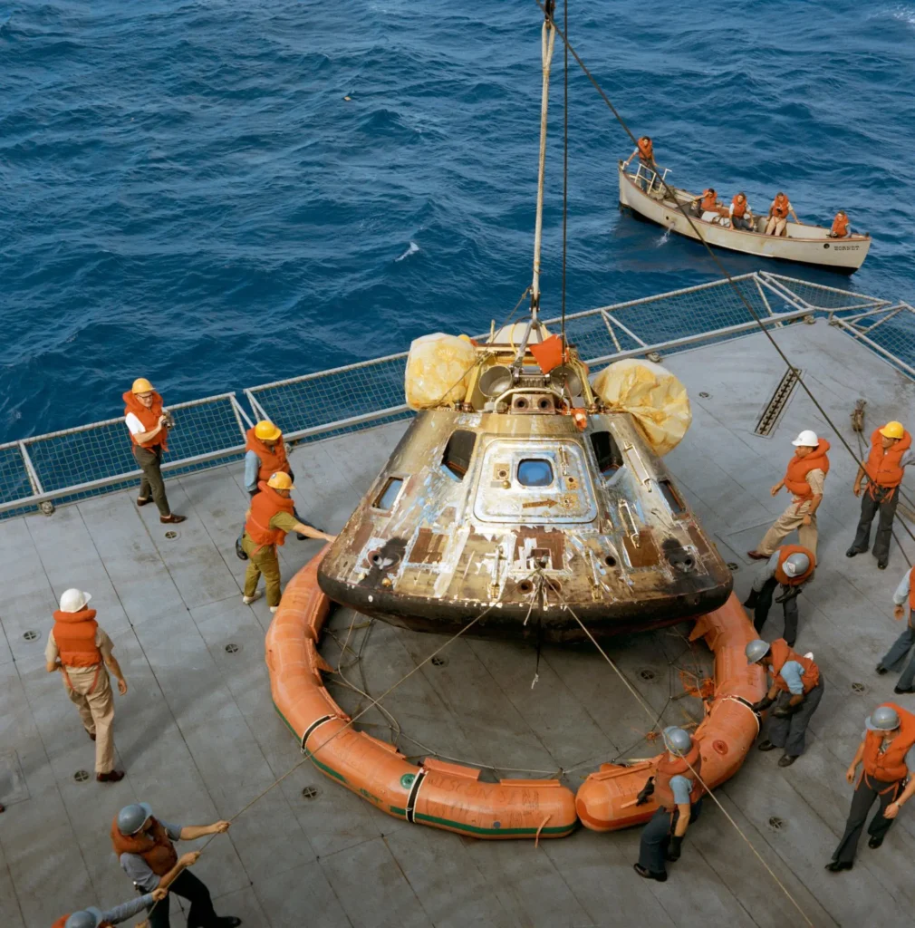 Apollo 11 spacecraft Command Module hoisted aboard U.S.S. Hornet